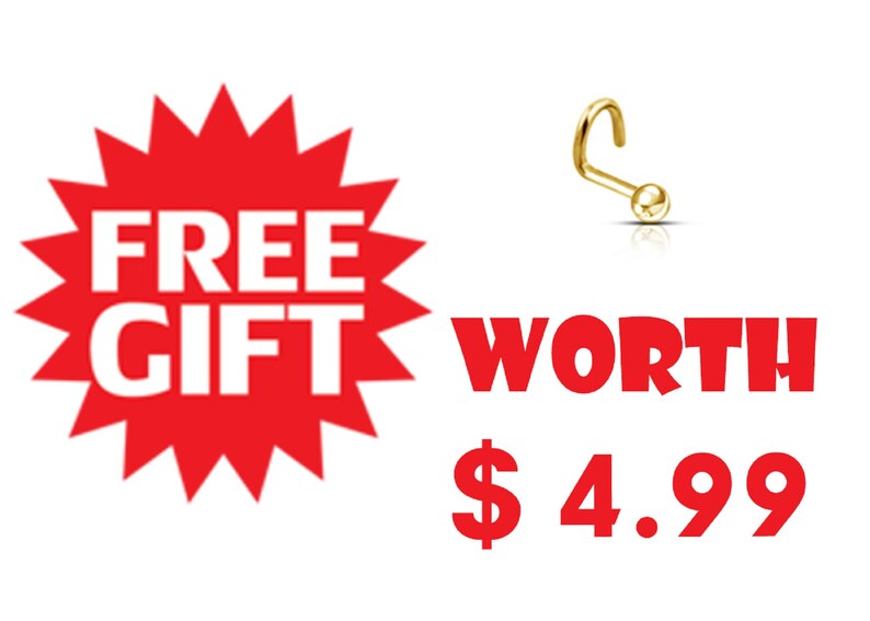 May include: A gold-colored nose ring with a curved post and a small ball end. The image includes a red burst with the words "FREE GIFT" in white and the word "WORTH" in red.