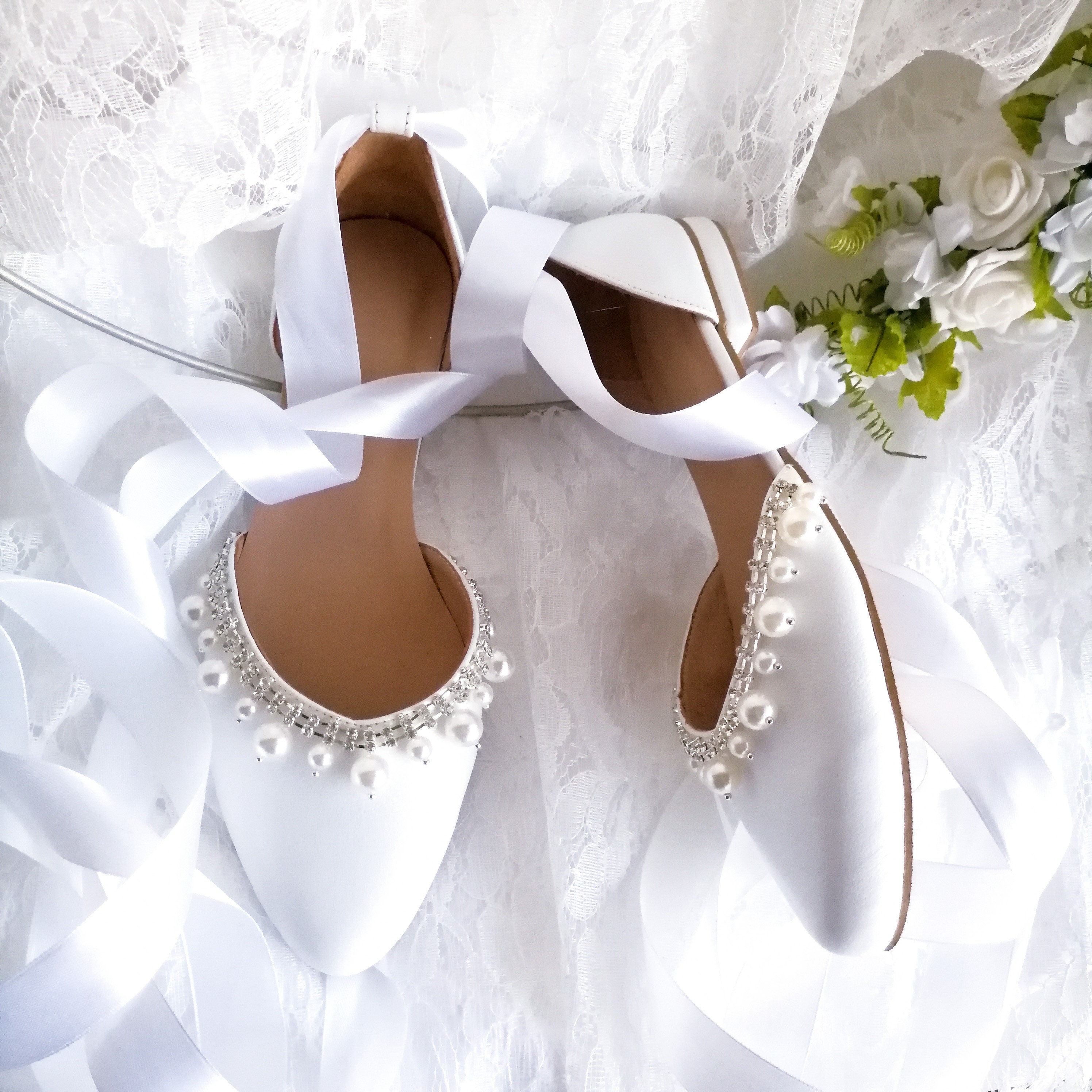 white ballet flats with ribbon ties