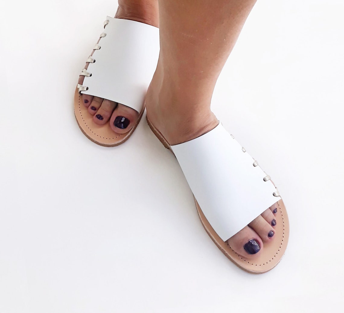white slip on flat sandals