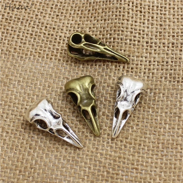 1 for one dolla!  holla for these cool bird skull charms.  Unique and cute, just like you, what are you waiting for, this is a great deal!