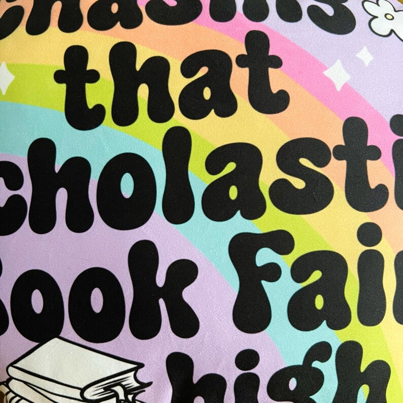May include: A colorful rainbow background with the text "I'm obsessed that Scholastic Book Fair is high"