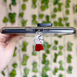 May include: A handmade wooden sign with the word "Welcome" in a whimsical font. The sign is painted white with a distressed finish, and features a small, decorative heart. It measures approximately 30 cm wide and 15 cm tall.