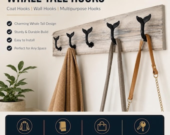 May include: A wall-mounted rack featuring five black metal hooks shaped like whale tails attached to a weathered, light gray wooden board. The text WHALE TALE HOOKS is displayed above, with icons for coats, towels, bags, and keys shown below.
