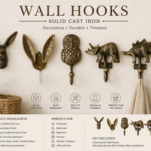 Pode incluir: Um conjunto de cinco ganchos de parede de ferro fundido sólido com acabamento em latão antigo. Os designs incluem uma cabeça de coelho, orelhas de coelho, uma coruja, um triceratops e um estegossauro. O texto WALL HOOKS SOLID CAST IRON está no topo.