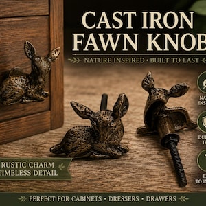 May include: Three bronze-coloured cast iron knobs shaped like resting fawns. The knobs feature textured surfaces and include a threaded metal bolt for attachment. Text on the image reads CAST IRON FAWN KNOB, NATURE INSPIRED, BUILT TO LAST, RUSTIC CHARM, TIMELESS DETAIL, NATURE INSPIRED, DURABLE IRON, EASY TO INSTALL, and PERFECT FOR CABINETS, DRESSERS, DRAWERS.