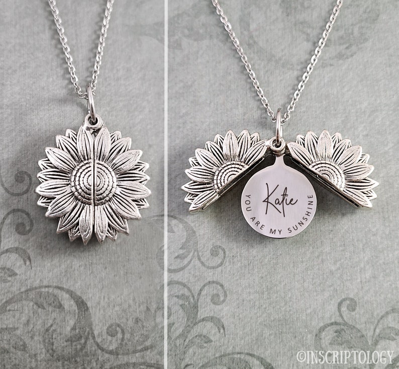 May include: Silver sunflower locket necklace with a personalized message inside that reads "You are my sunshine Katie".
