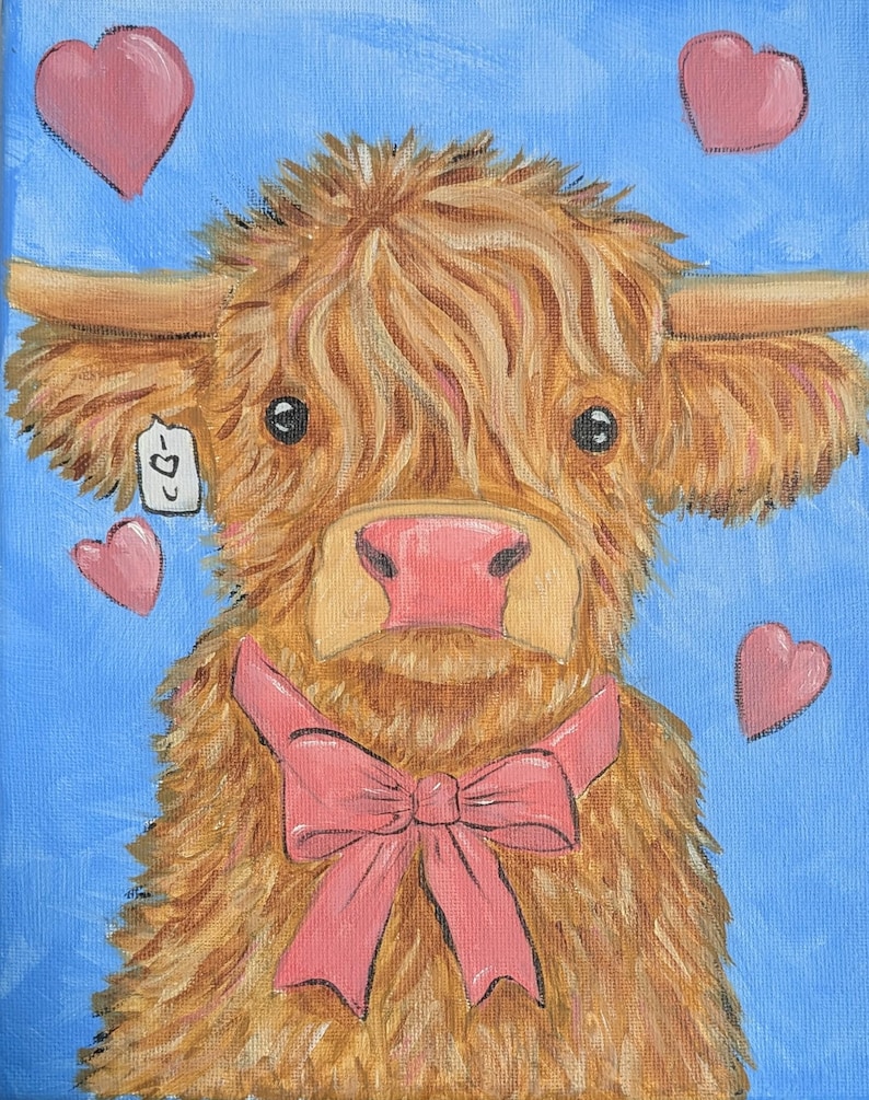 May include: A painting of a Highland cow with a pink bow and pink hearts on a blue background. The cow has long, shaggy, light brown fur, a pink nose, and a small tag hanging from its ear.