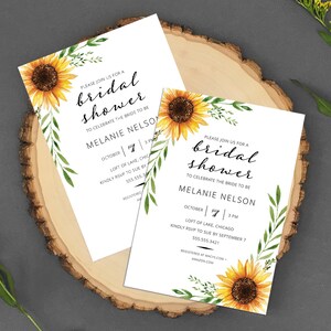 May include: Two white cards with black text and sunflower illustrations. The text reads "Please join us for a bridal shower to celebrate the bride to be Melanie Nelson. October 7, 3 PM. Loft of Lake Chicago. Kindly RSVP to Sue by September 7. 555.555.3421."