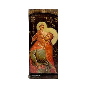 Christelijk-orthodox pictogram van Sint-Christoffel op hout met gouden printachtergrond
