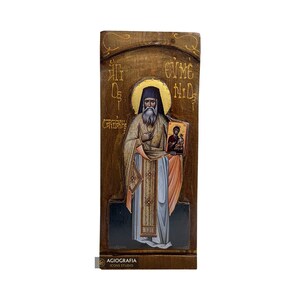 Christelijk-orthodoxe heilige Evmenios Saridakis pictogram op hout met gouden printachtergrond