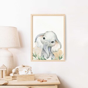 May include: A watercolor painting of a cute baby elephant with big ears and large eyes. The elephant is surrounded by green leaves and a light brown background.