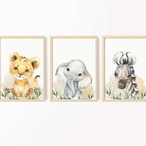 May include: Three framed watercolor illustrations of jungle animals. A lion cub, an elephant calf, and a zebra foal are depicted in a whimsical style with green foliage.
