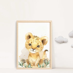 May include: A watercolor illustration of a cute, cartoon lion cub with brown spots sitting in a patch of green leaves. The lion cub is looking at the viewer with a friendly expression.