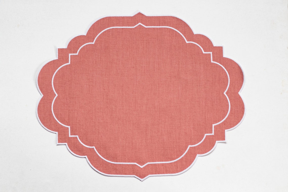Woodrose pink linen scalloped table mats with double white image 3