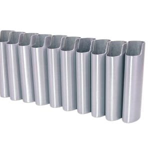 May include: A row of eleven silver-colored, open-ended metal tubes. Each tube has a rounded bottom and a curved top, creating a U-shaped opening. The tubes are arranged in a slightly curved line against a white background.