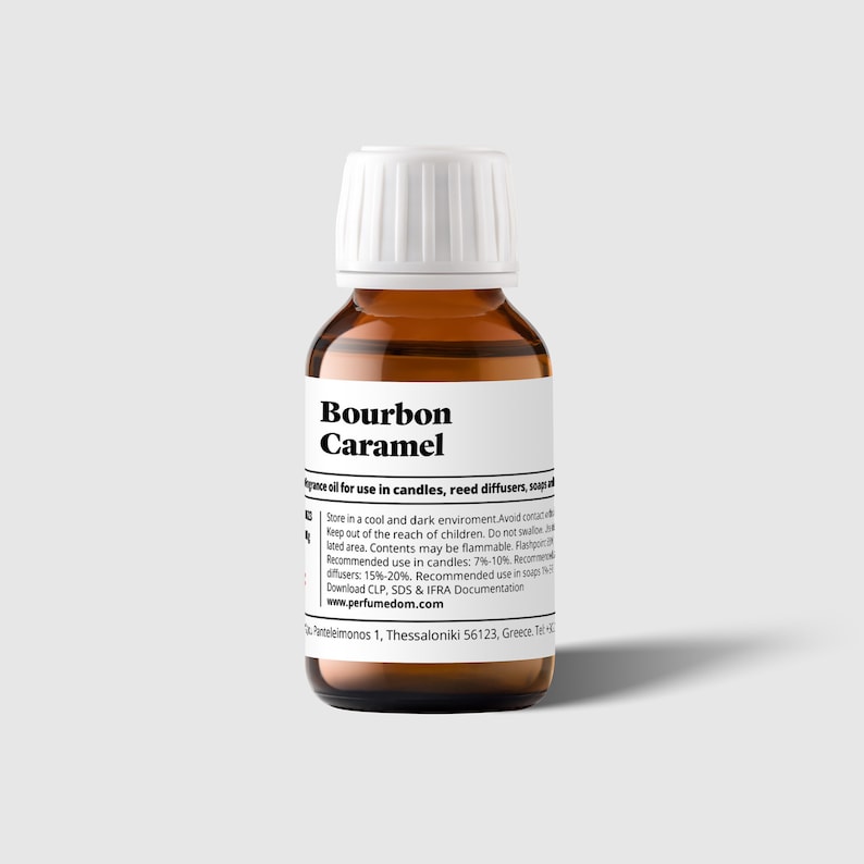 May include: A brown glass bottle with a white cap, labeled "Bourbon Caramel" fragrance oil for use in candles, reed diffusers, and soap. The label also includes instructions for use and storage.
