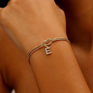 Custom 14K Gold Infinite Love Knot Bracelet with CZ Diamond Letter by NecklaceDreamWorld | Dainty Friendship Bracelets