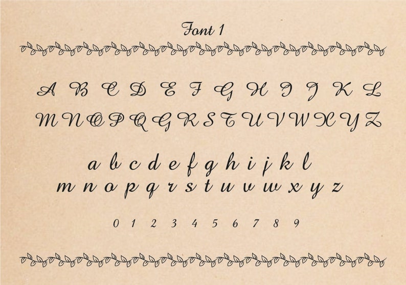 Font 1 in black script font on a tan background. The alphabet is displayed in uppercase and lowercase letters. Numbers 0 through 9 are also displayed.