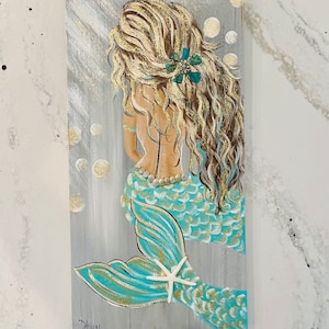 Aqua blue mermaid on wood