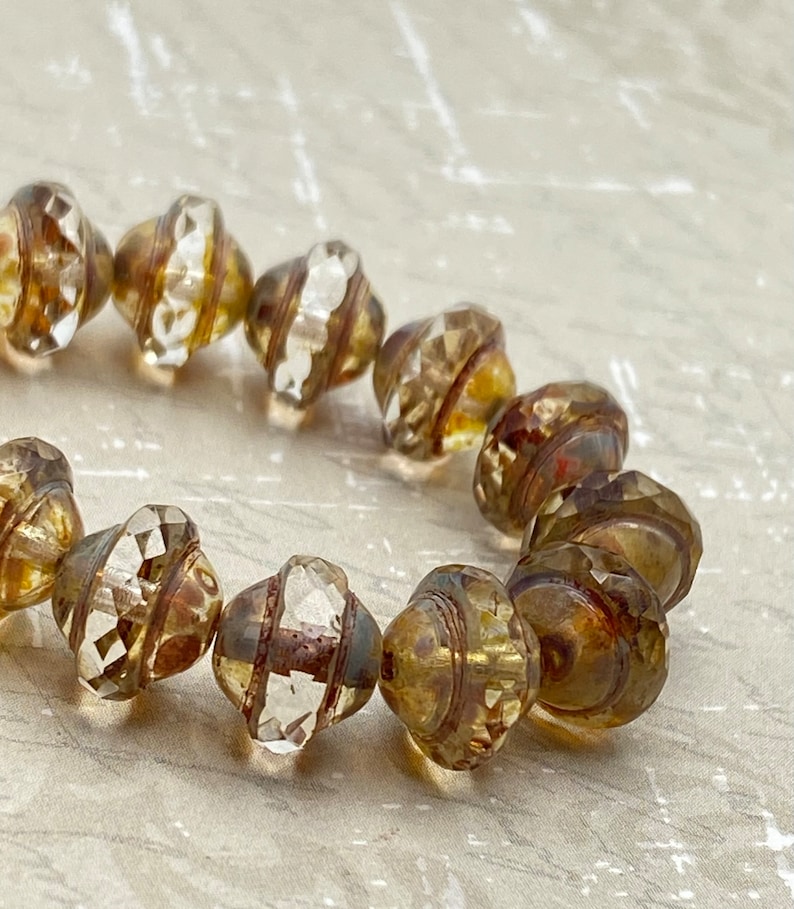 cuentas-de-cristal-checo-saturno-de-8-x-10-mm-transparentes-con