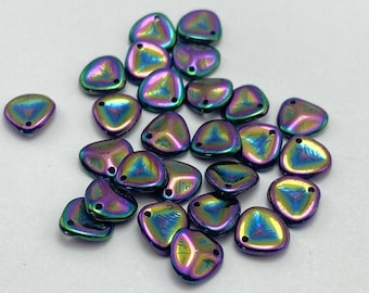 Twenty-five Czech glass rose petal beads in iridescent purple and green with rainbow flash on a white background.