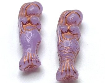 Two purple Czech mermaid beads with copper wash detail, shown on a plain background.
