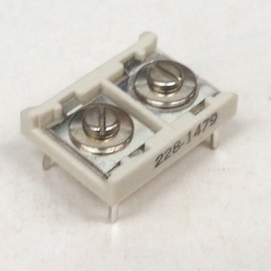 May include: White plastic electrical component with two screw terminals. The component is labeled "228-1479".
