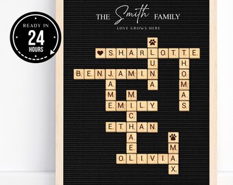 May include: A black framed print with a white background and a black letter board with the text "THE Smith FAMILY LOVE GROWS HERE" and a crossword puzzle with the names Charlotte, Benjamin, Emily, Ethan, and Olivia.