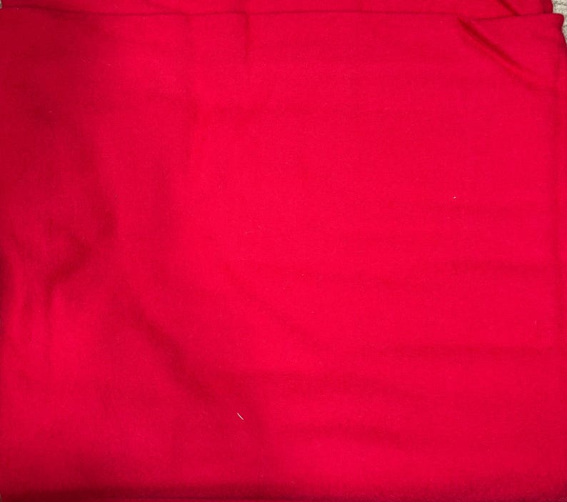 May include: A solid red fabric swatch. The fabric is smooth and has a slight sheen.