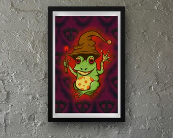 May include: A green frog wearing a brown wizard hat and holding a red and gold wand. The frog is sitting on a purple background with a pattern of black skulls.