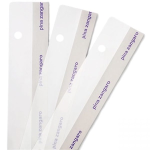 May include: Three white plastic strips with a hole in the top and the text "pina zangaro" printed in purple on each strip.