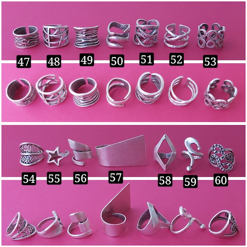 May include: A collection of 20 silver rings with various designs, including geometric shapes, stars, and swirls. The rings are arranged in three rows on a pink background. The numbers 47 through 60 are printed below each ring.