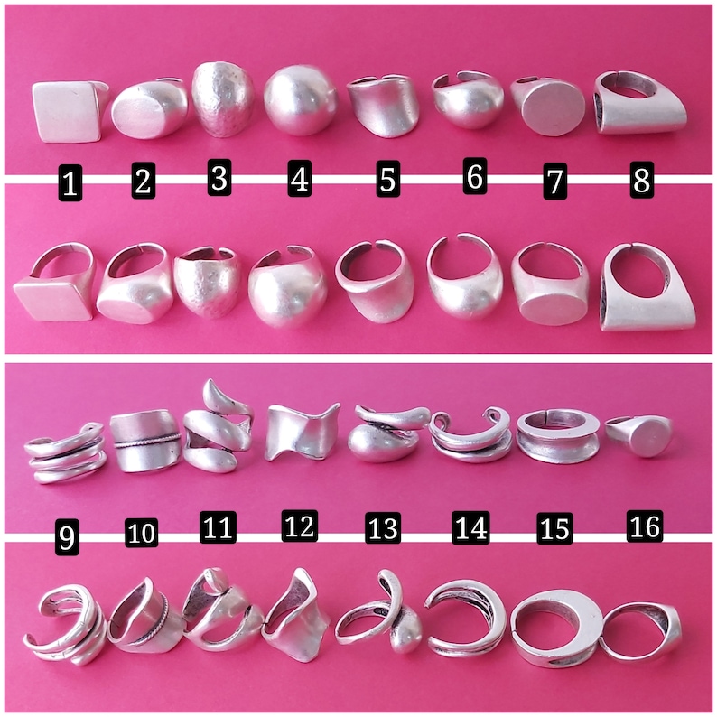 May include: A collection of 16 silver rings in various shapes and sizes. The rings are arranged in three rows, with the first row containing 8 rings, the second row containing 8 rings, and the third row containing 8 rings.