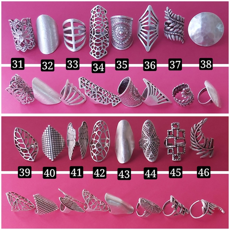 May include: A set of 46 silver rings with various designs, including geometric, floral, and leaf patterns. The rings are arranged in three rows, with numbers 31-38, 39-46, and 1-8 below each row.