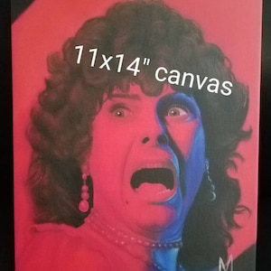May include: A 11x14 inch canvas painting of a woman with dark hair, screaming with her mouth open. The woman's face is painted in shades of blue and red. The painting is signed with the letter "M" in the bottom right corner.