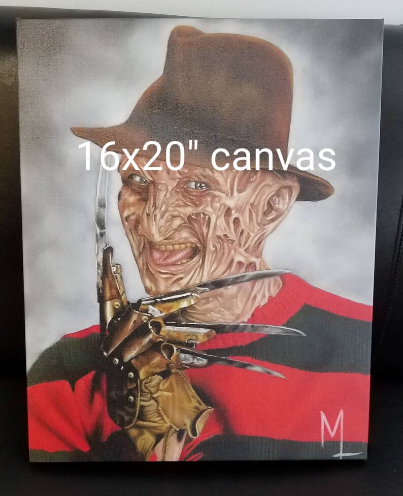 May include: A 16x20 inch canvas painting of Freddy Krueger from the Nightmare on Elm Street movie franchise. He is wearing a red and black striped sweater, a brown fedora, and a glove with blades. He has a disfigured face with a sinister smile.