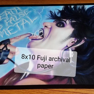 May include: An 8x10 inch print on archival paper of a colorful illustration of a person with dark hair and a black glove, with the text "Death to False Metal" in the background.