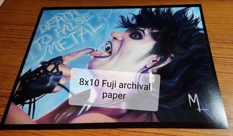 May include: An 8x10 inch print on archival paper of a colorful illustration of a person with dark hair and a black glove, with the text "Death to False Metal" in the background.