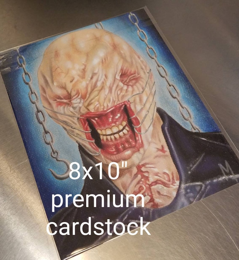 May include: A hand-drawn illustration of a monstrous creature with a stitched-up mouth and a chain around its neck. The illustration is on 8x10 inch premium cardstock.