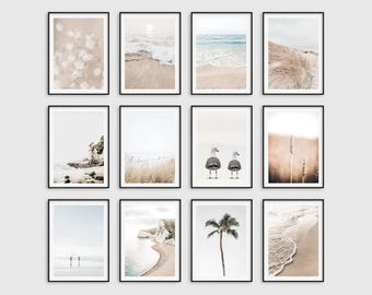 May include: A collection of twelve framed art prints featuring coastal and nature scenes. The prints showcase images of beaches, waves, seagulls, and plants in neutral tones. Each print is encased in a black frame, creating a cohesive aesthetic.