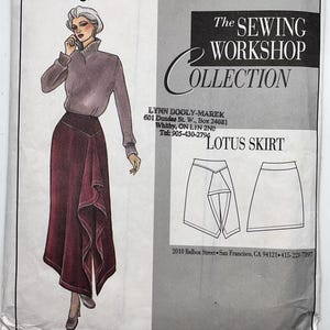 May include: A sewing pattern envelope for The Sewing Workshop Collection Lotus Skirt. The front features an illustration of a person wearing a high-neck sweater and a long, dark red skirt with a draped front panel, alongside line drawings of the skirt.