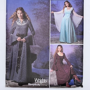 May include: A Simplicity Costumes sewing pattern envelope featuring three variations of a long-sleeved gown. The package displays the text Simplicity COSTUMES, Wrights Simplicity Trims, and size HH 6, 8, 10, 12. The images show dresses in grey, light blue, and dark red.