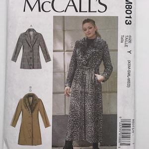 May include: A McCall's sewing pattern envelope featuring a woman in a long leopard print coat. The envelope also shows illustrations of a plaid blazer and a brown coat with a faux fur collar. The pattern number is M8013.
