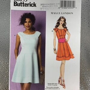 May include: A Butterick sewing pattern, B6053, featuring two dress designs. One dress is light blue, and the other is orange with a pink belt. The pattern includes sizes 8-16 and is for A/B, C, D cup sizes.