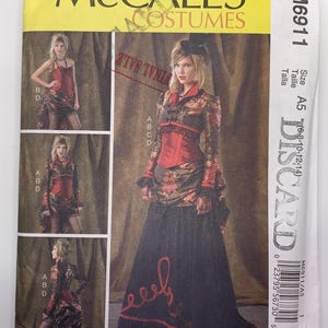 May include: McCall's Costumes sewing pattern M6911. The pattern features a woman's costume with a red corset, black skirt, and long-sleeved top. The pattern includes multiple views and sizes A5 (6-8-10-12-14). The words "FINAL SALE" are stamped on the pattern.