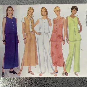 May include: A sewing pattern showing five women in various outfits. The designs include button-down tops with skirts, trousers, and a vest. The colour scheme features purple, tan, white, pink, and lime green. The outfits are designed for women.
