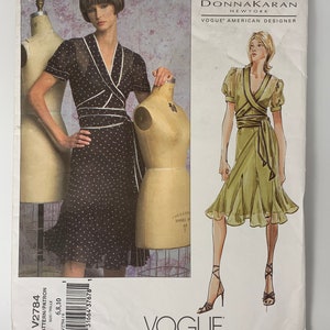 May include: A sewing pattern for a wrap dress with a polka dot print. The pattern is from Vogue Patterns and is designed by Donna Karan. The pattern number is V2784.