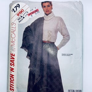 May include: A vintage McCall's Stitch 'n Save sewing pattern for a skirt. The pattern is for sizes 6-8-10 and is priced at £1.79. The pattern features a woman wearing a white turtleneck sweater and a black and white plaid skirt.
