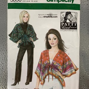 May include: Simplicity sewing pattern 3830 showing two poncho designs. Sizes R5 14, 16, 18, 20, and 22 are included. The front of the pattern features illustrations of the finished garments. Includes the Patty Reed Designs logo and website address.