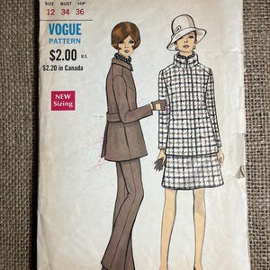 May include: Vintage Vogue pattern envelope with illustrations of two women in 1960s outfits. One wears a brown suit, the other a checkered coat and skirt. The envelope includes pattern number 7496 and sizing details. The price is shown as $2.00 U.S.